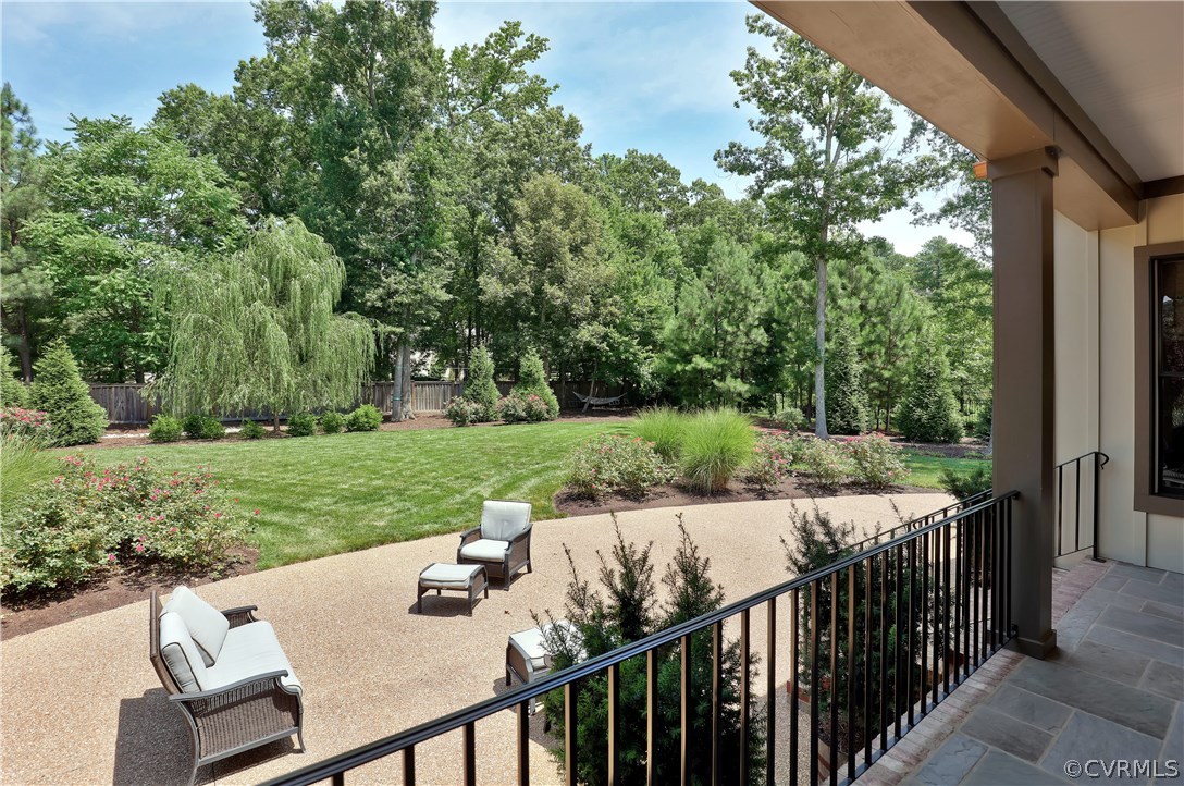13430 Stonegate Road Midlothian, VA 23113 - Photo 31 of 35 a view of a patio with a table chairs and a backyard
