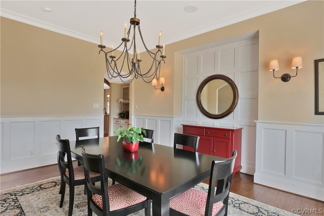 13430 Stonegate Road Midlothian, VA 23113 - Photo 8 of 35 a view of a dining room with furniture and a chandelier