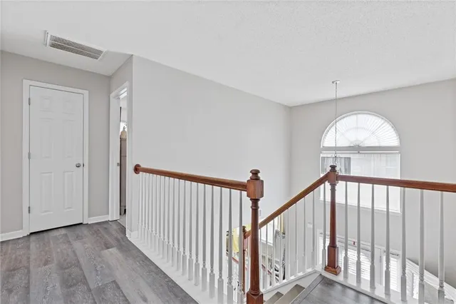a view of staircase with wooden floor and stairs