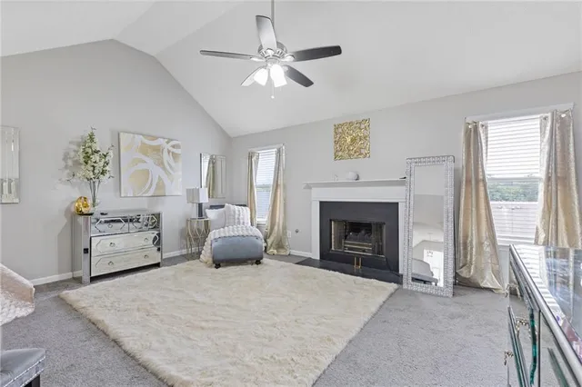 a bedroom with a bed and a fireplace