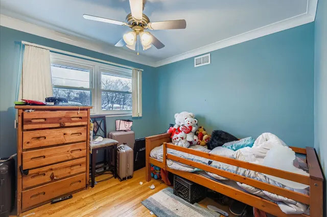 a bed room with a bed and a window