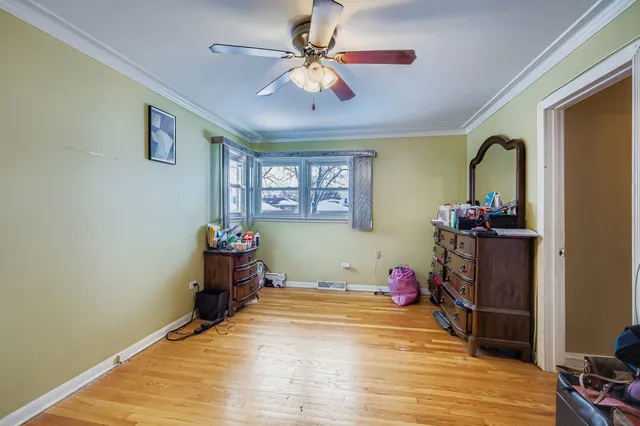 a bedroom with a bed and a mirror