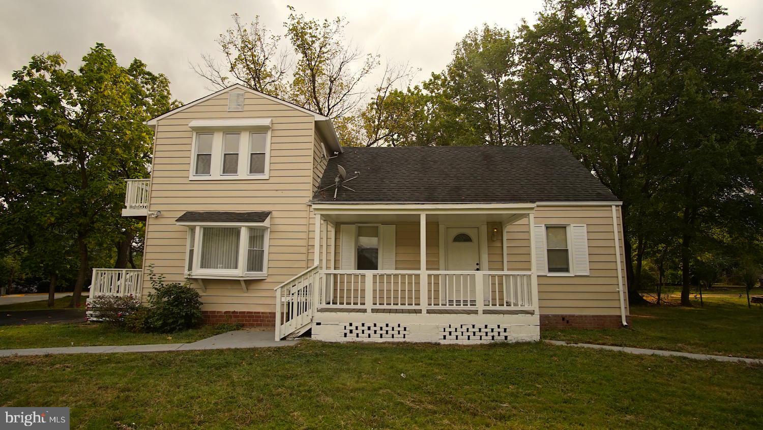 6501 Randolph Road Morningside, MD 20746 - Photo 1 of 35 a front view of a house with a yard
