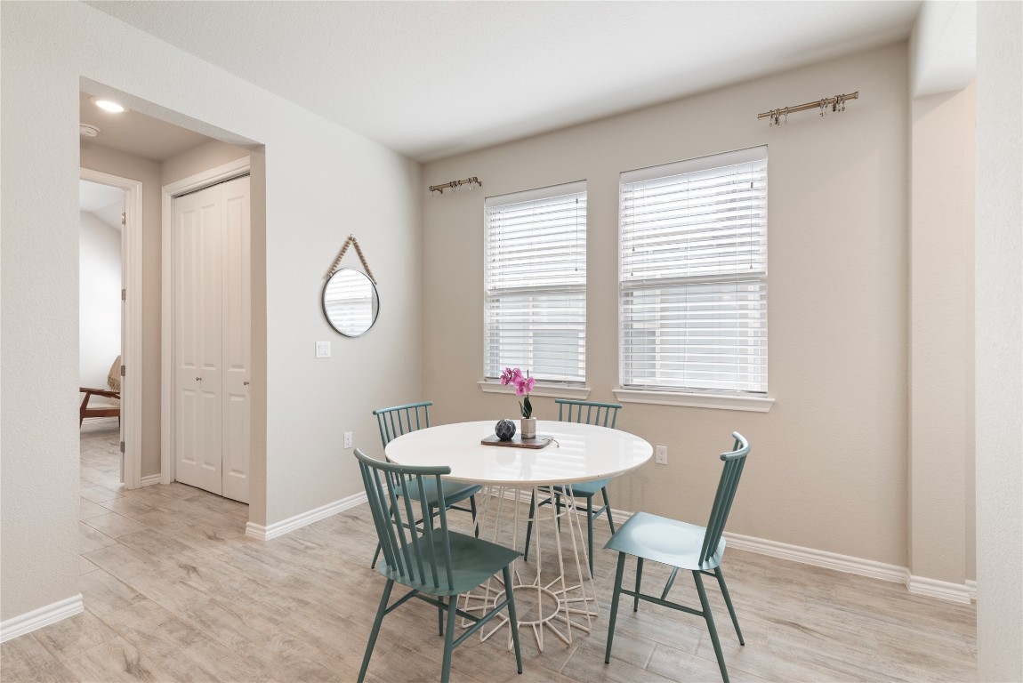 121 Bolivar Way, Unit 101 San Marcos, TX 78666 - Photo 10 of 33 a dining room with furniture and window