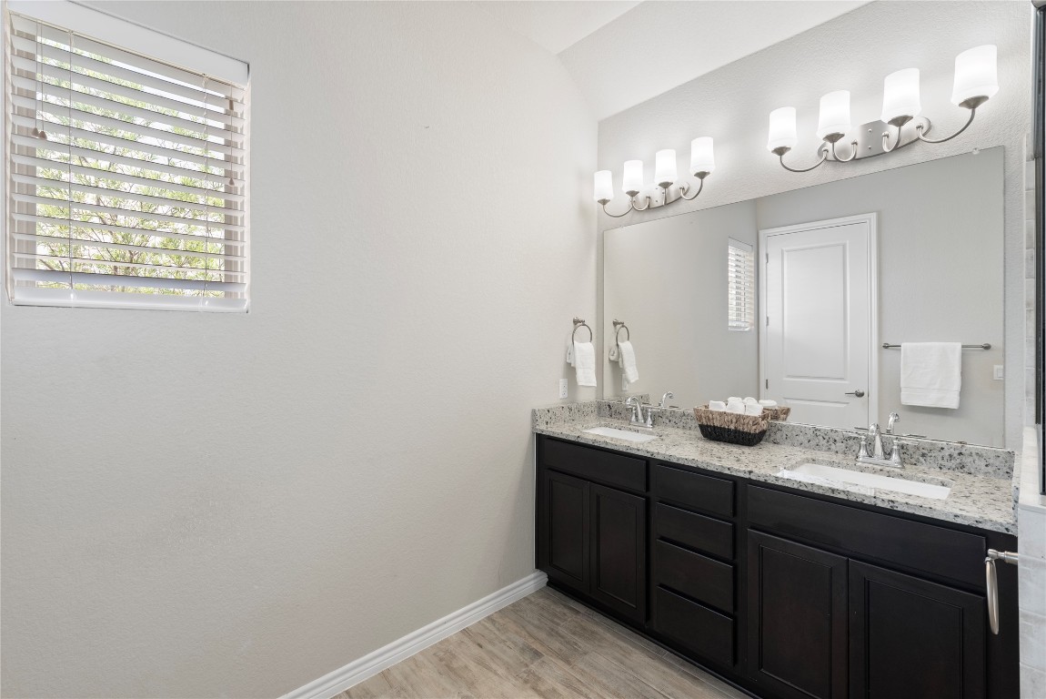 121 Bolivar Way, Unit 101 San Marcos, TX 78666 - Photo 14 of 33 a bathroom with a sink and a mirror