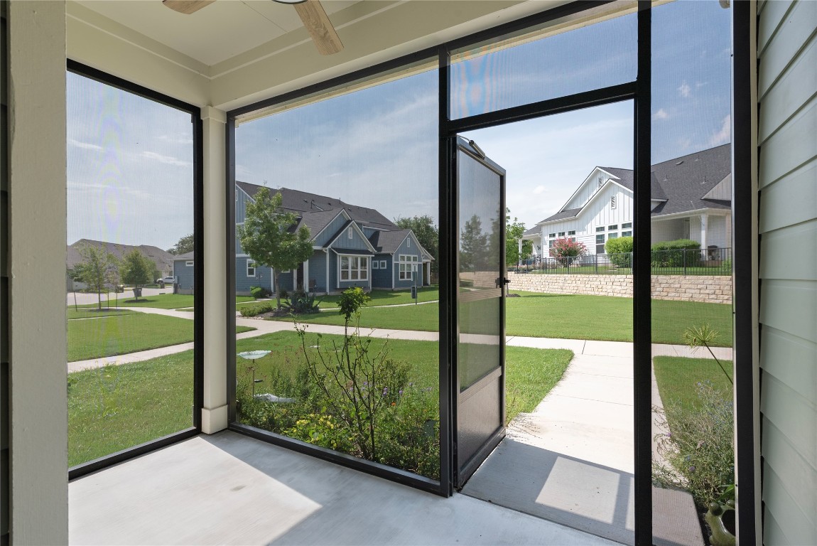121 Bolivar Way, Unit 101 San Marcos, TX 78666 - Photo 2 of 33 a view of a glass door with a yard from a living room