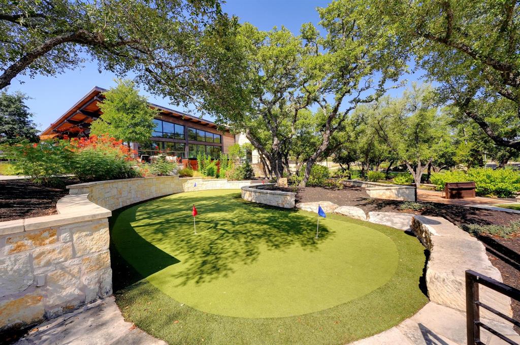 121 Bolivar Way, Unit 101 San Marcos, TX 78666 - Photo 28 of 33 a swimming pool with outdoor seating and yard