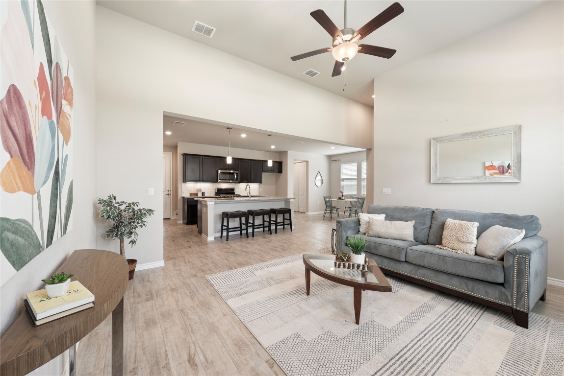 121 Bolivar Way, Unit 101 San Marcos, TX 78666 - Photo 5 of 33 a living room with furniture and wooden floor