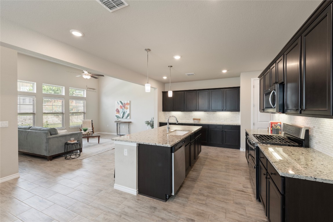 121 Bolivar Way, Unit 101 San Marcos, TX 78666 - Photo 33 of 33 a large kitchen with stainless steel appliances lots of counter top space