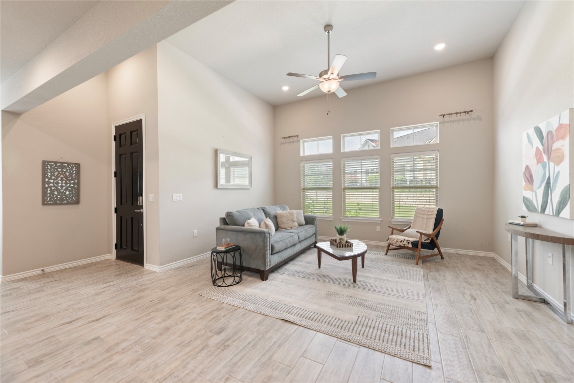 121 Bolivar Way, Unit 101 San Marcos, TX 78666 - Photo 9 of 33 a living room with furniture and wooden floor