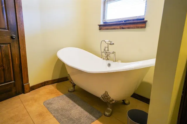 a bed room with furniture and a window