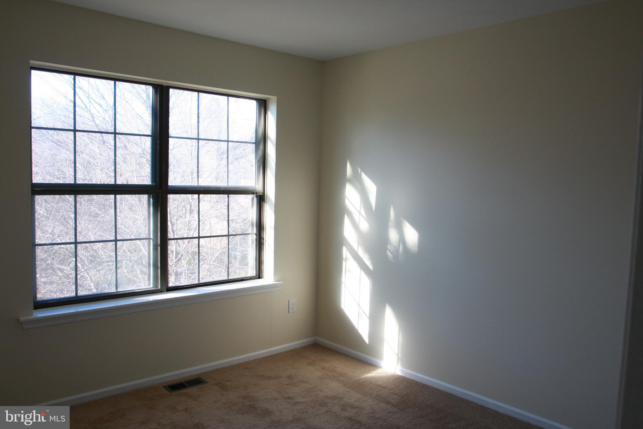 1195 Heyward Road, Unit 36 Chesterbrook, PA 19087 - Photo 13 of 15 a view of an empty room with a window