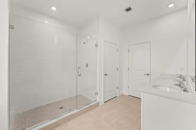 a bathroom with a sink and shower