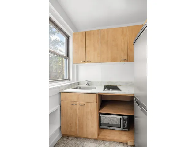 a living room with furniture wooden floor and a flat screen tv