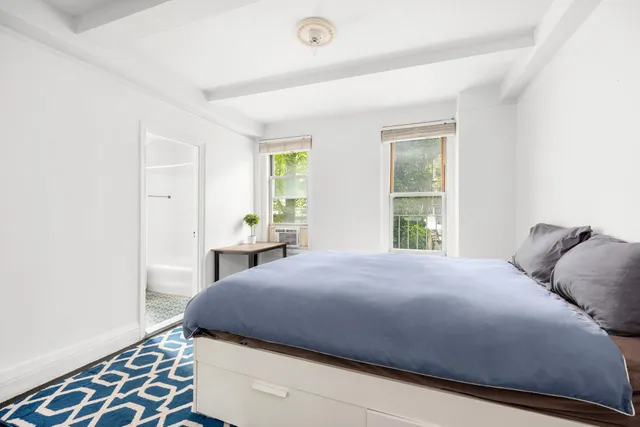 a room with sink and cabinets