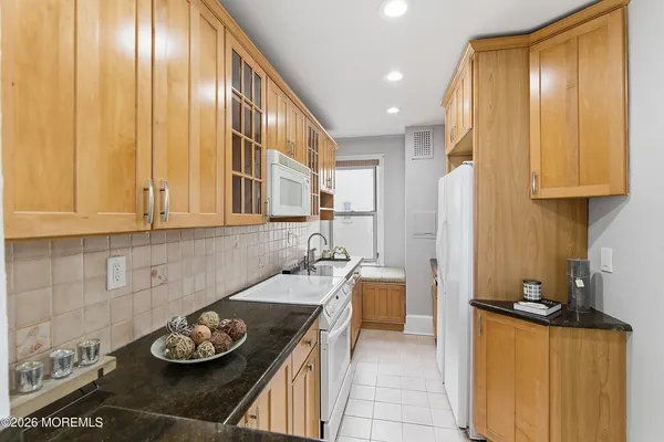 a kitchen with a table and chairs in it