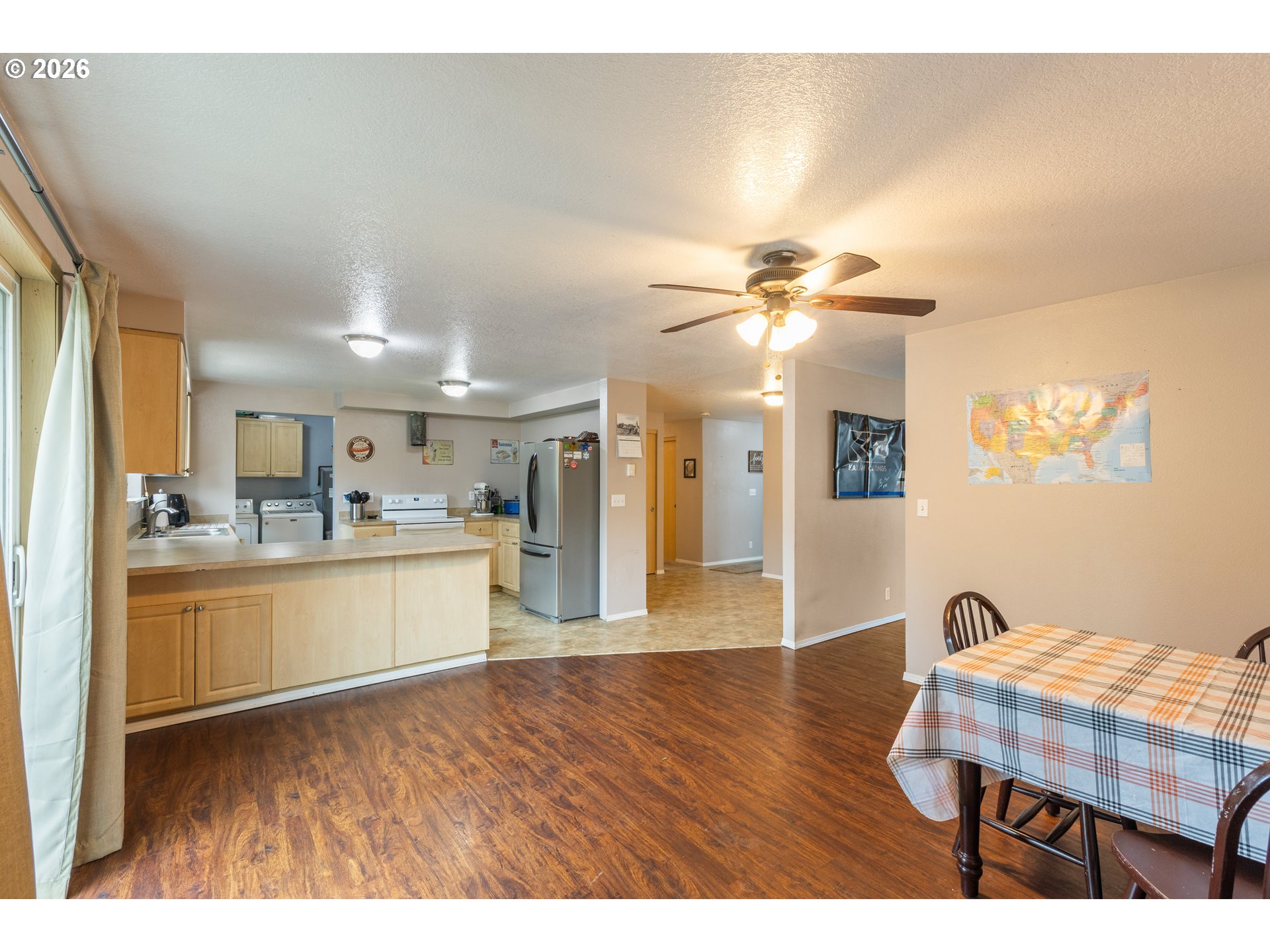 220 Southeast Wells Road Oakland, OR 97462 - Photo 16 of 45 a view of kitchen with cabinets and wooden floor