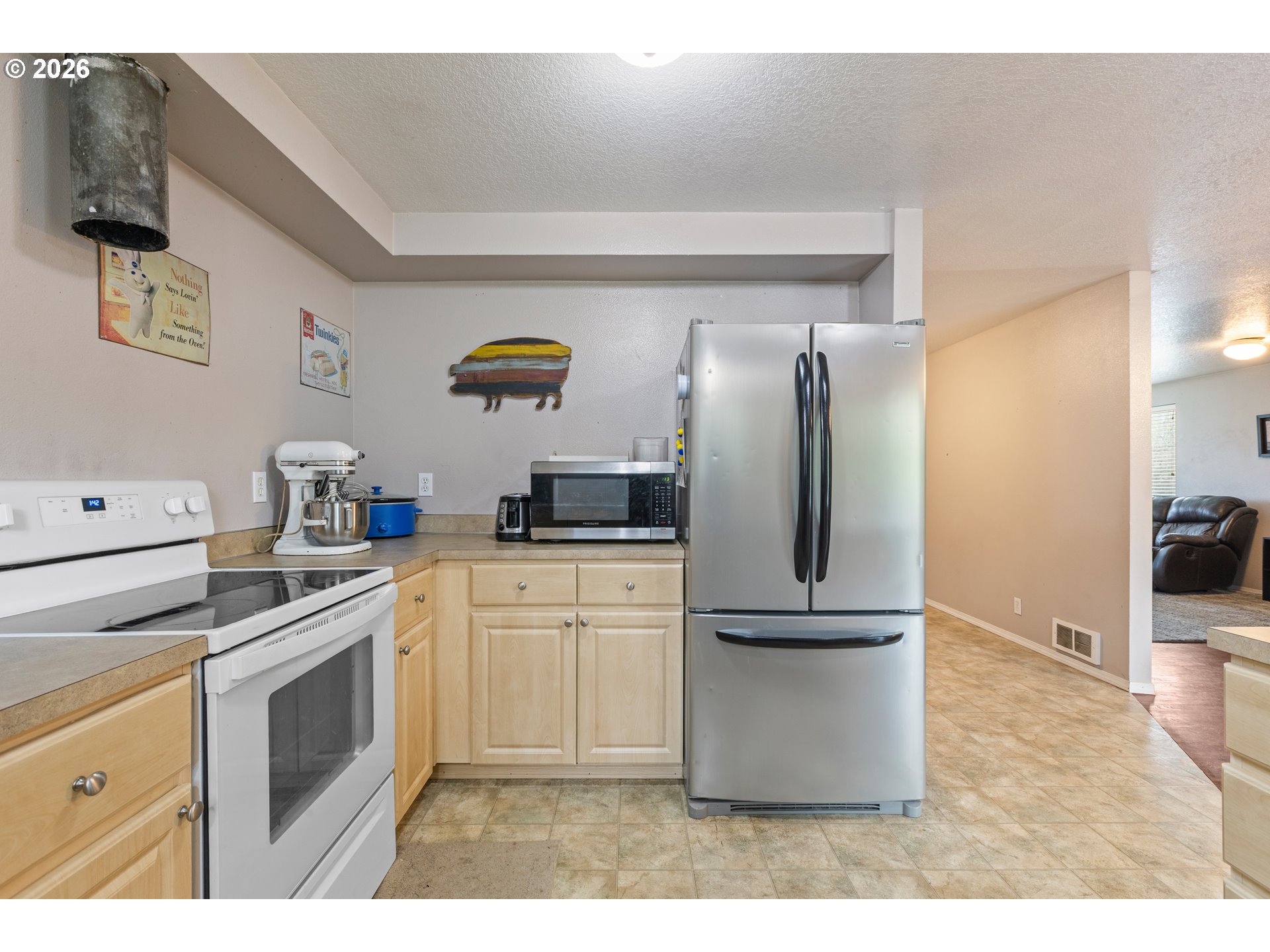 220 Southeast Wells Road Oakland, OR 97462 - Photo 19 of 45 a kitchen with stainless steel appliances granite countertop a refrigerator a stove a sink and dishwasher
