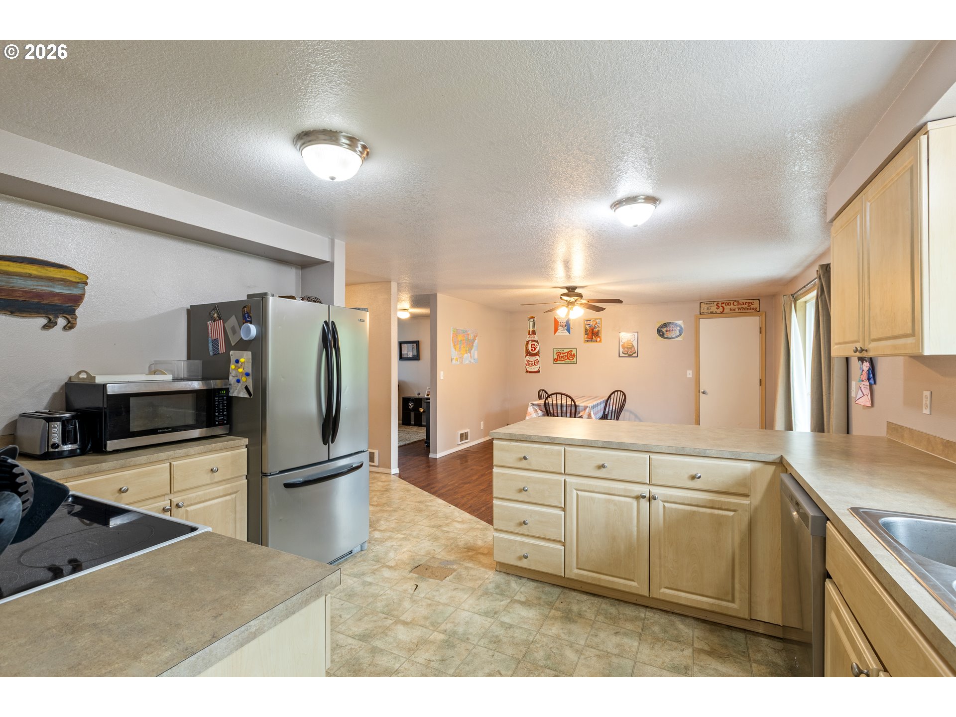 220 Southeast Wells Road Oakland, OR 97462 - Photo 20 of 45 a kitchen with refrigerator cabinets and furniture