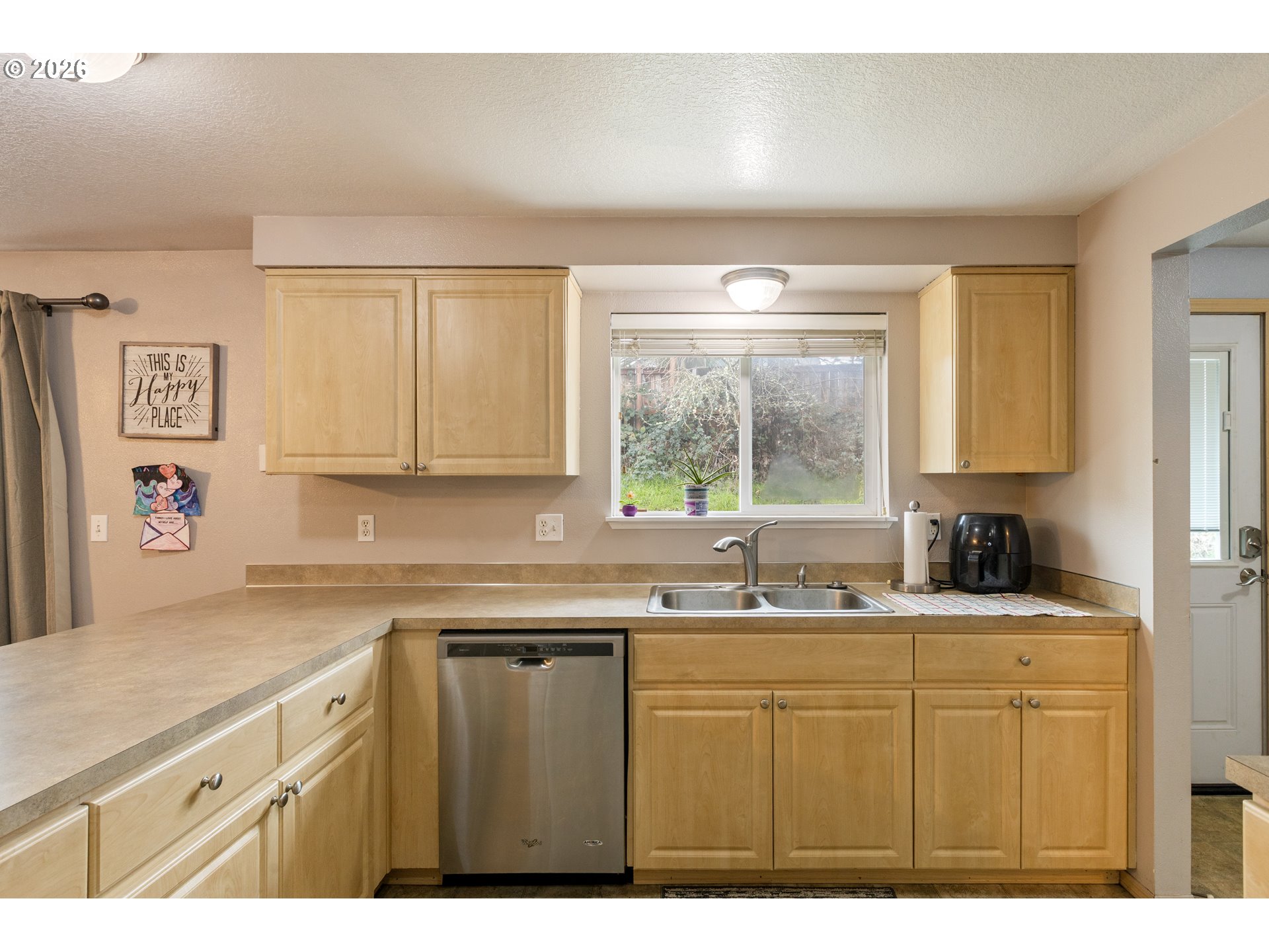 220 Southeast Wells Road Oakland, OR 97462 - Photo 22 of 45 a kitchen with a sink a window and cabinets