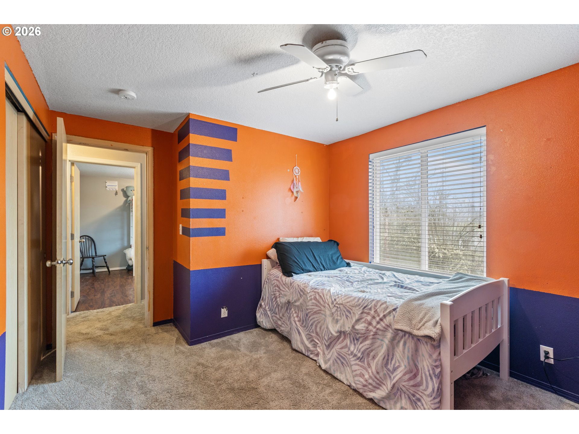 220 Southeast Wells Road Oakland, OR 97462 - Photo 33 of 45 a bedroom with a large bed and a chandelier