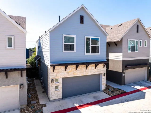 a view of a house with a garage