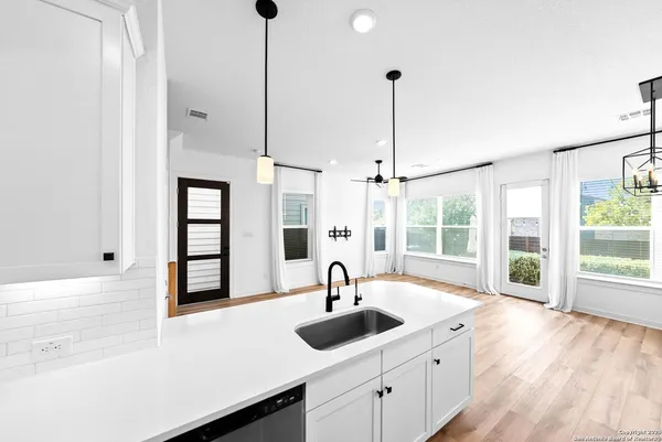 a kitchen with sink and window