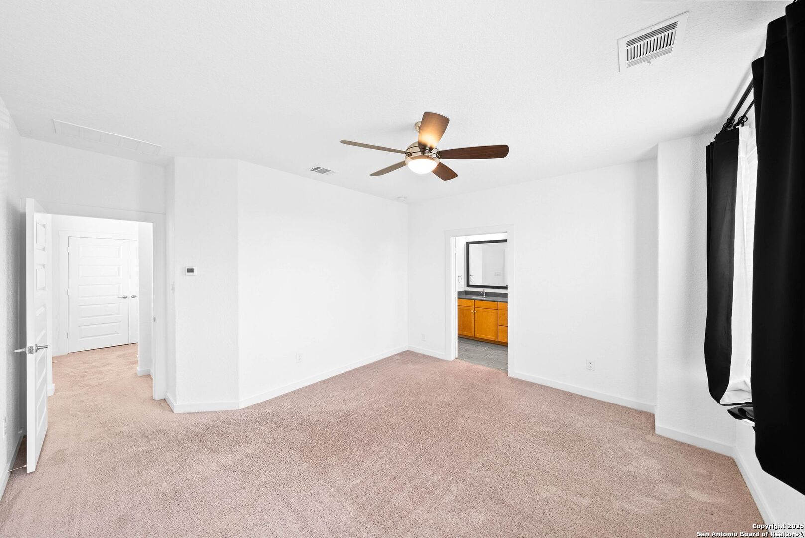 5843 Whitby Road, Unit 3 San Antonio, TX 78240 - Photo 18 of 37 a view of a livingroom with a ceiling fan and wooden floor