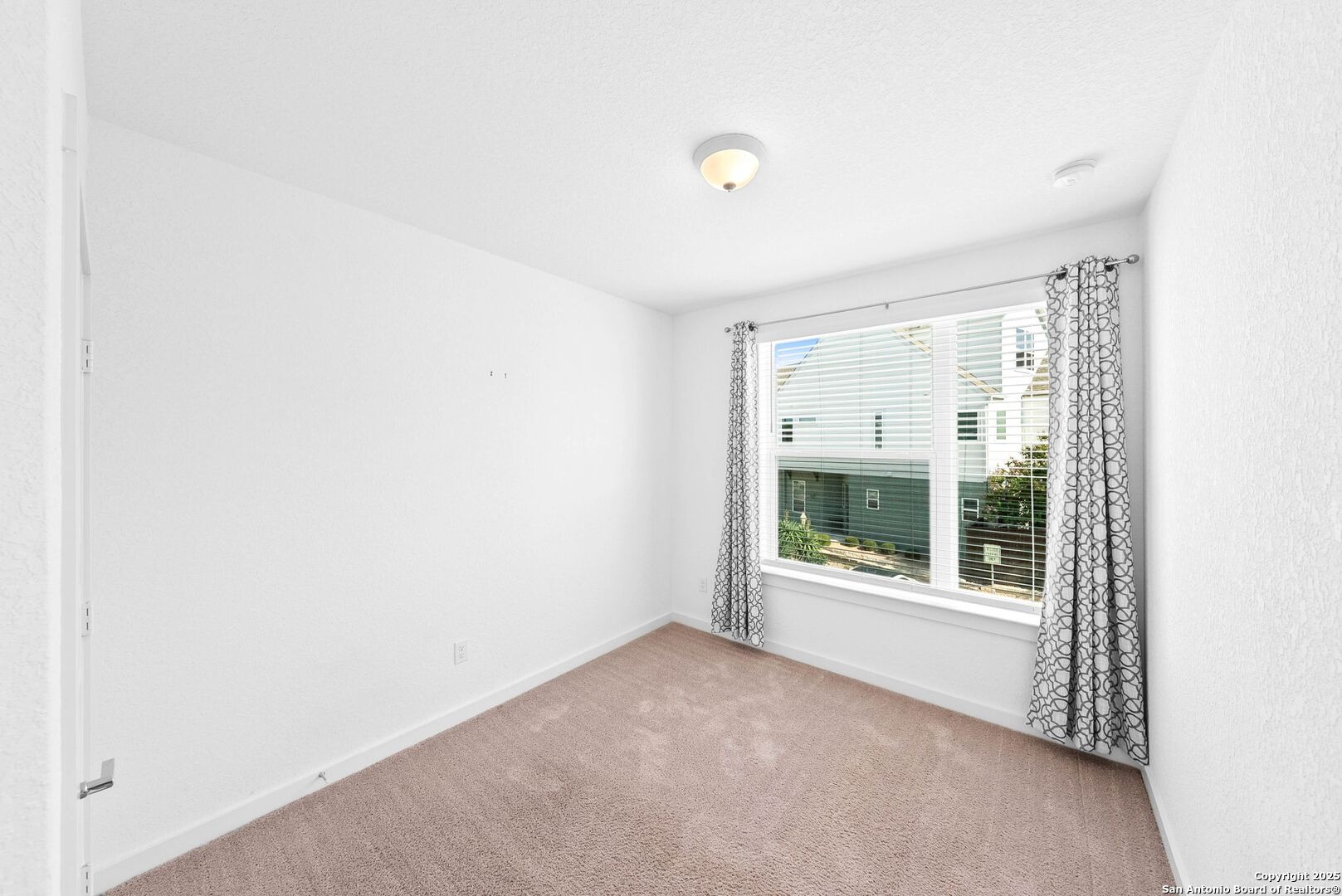 5843 Whitby Road, Unit 3 San Antonio, TX 78240 - Photo 22 of 37 a view of an empty room with a window