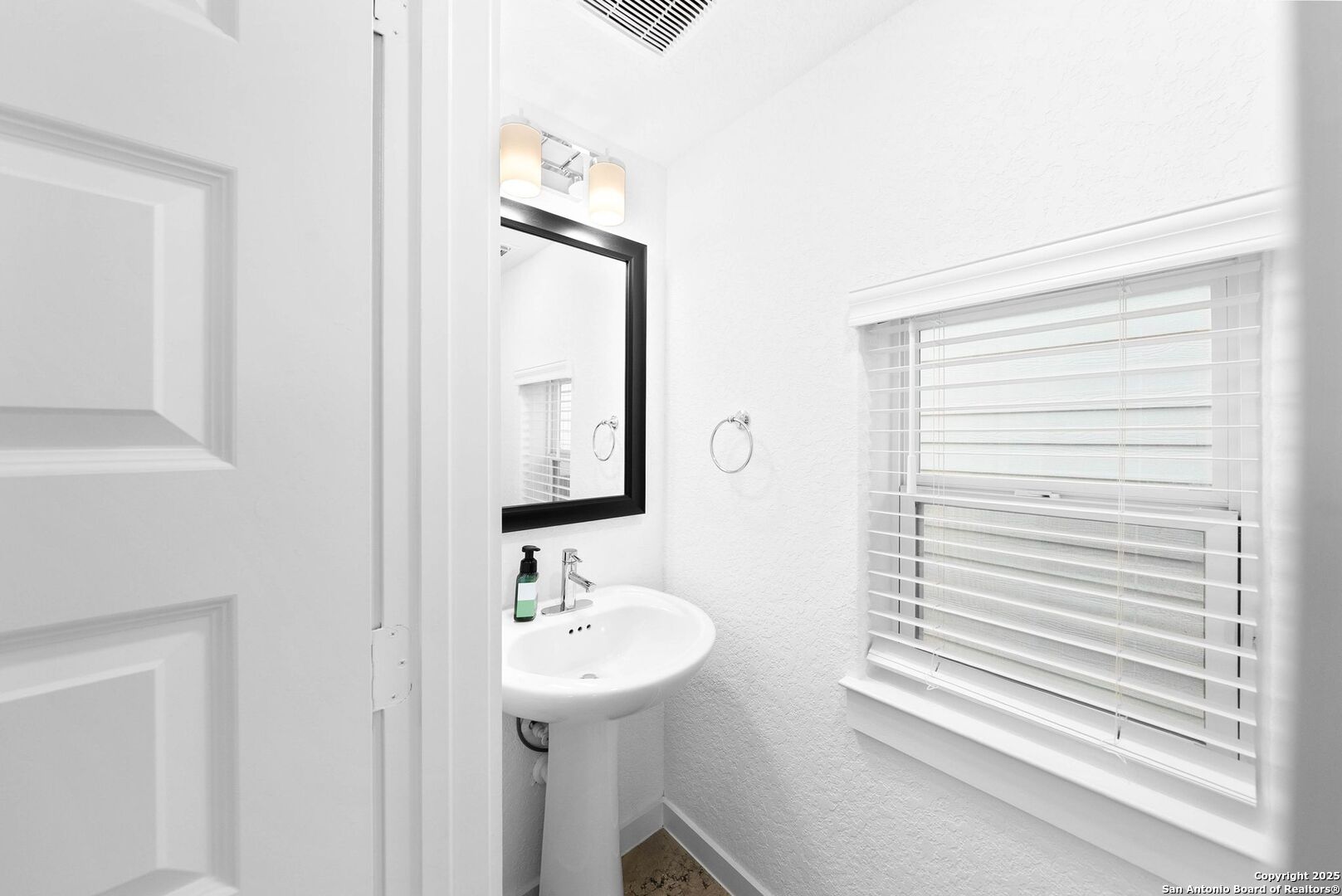5843 Whitby Road, Unit 3 San Antonio, TX 78240 - Photo 28 of 37 a bathroom with a sink a mirror and a shower