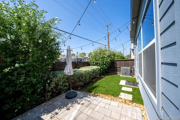 a view of yard with patio