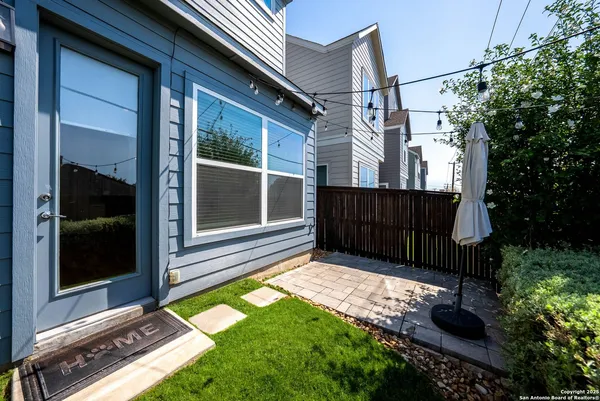 a view of house with backyard and garden