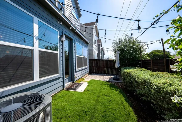 a view of house with backyard