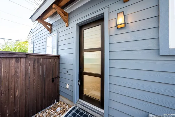 a view of a door and a window