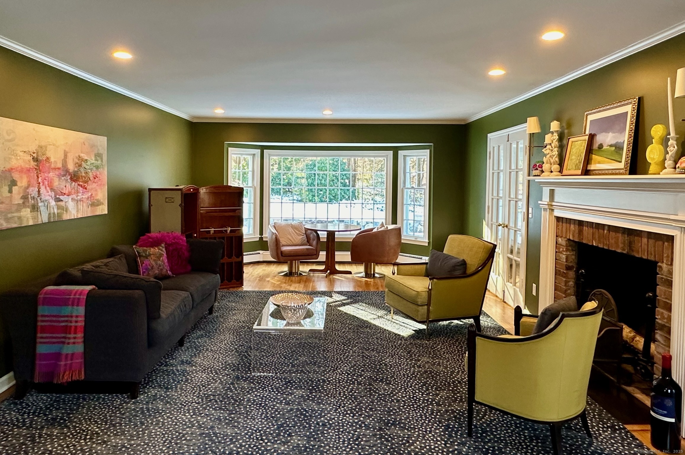 25 Deacons Lane Wilton, CT 06897 - Photo 14 of 37 a living room with fireplace furniture and a flat screen tv