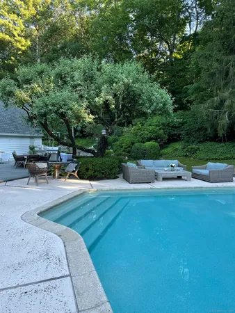 an outdoor space with furniture and umbrella