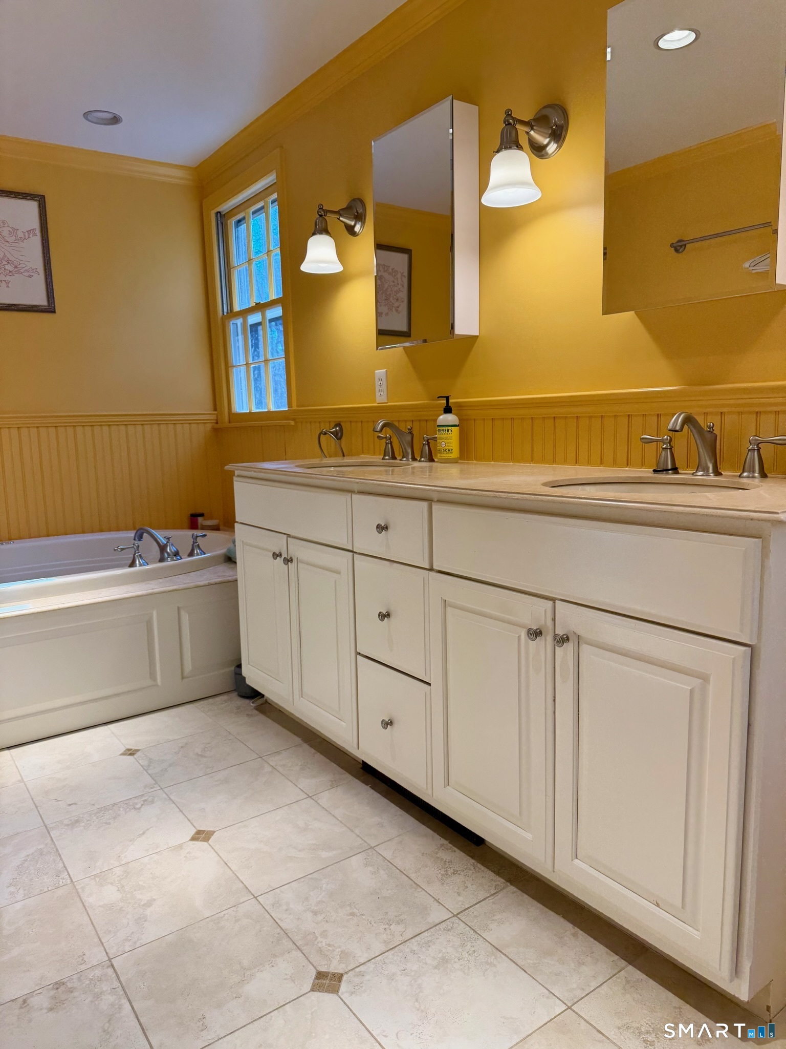 25 Deacons Lane Wilton, CT 06897 - Photo 22 of 37 a spacious bathroom with a tub sink and mirror