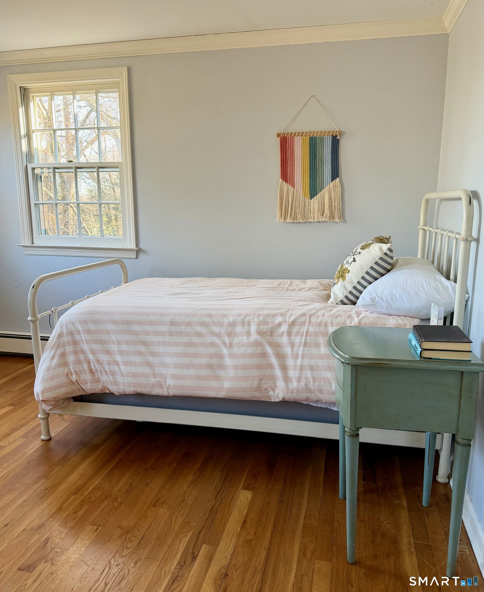 25 Deacons Lane Wilton, CT 06897 - Photo 23 of 37 a bedroom with a bed and a window