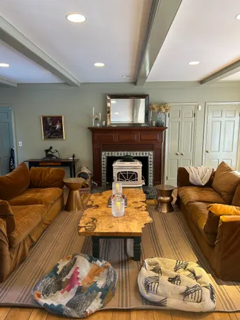 a view of a dining room with furniture and chandelier