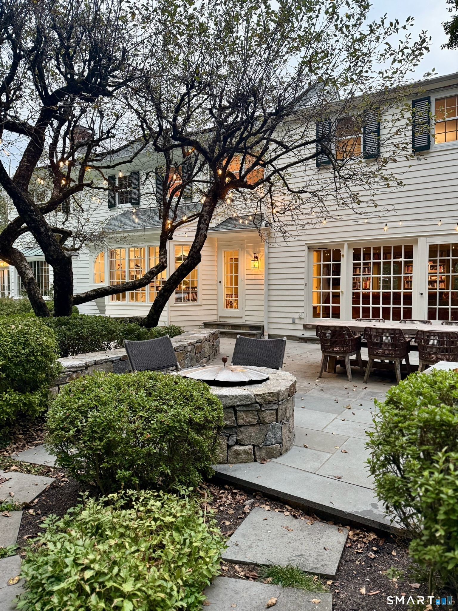 25 Deacons Lane Wilton, CT 06897 - Photo 5 of 37 a house view with a sitting space fire pit and outdoor space