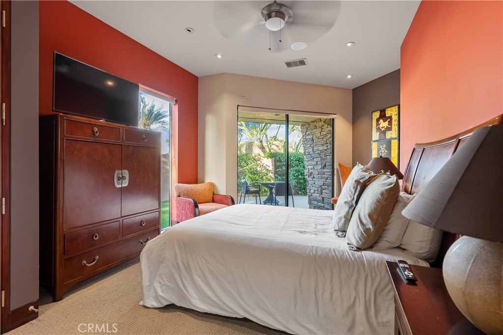 68 Royal St Georges Way Rancho Mirage, CA 92270 - Photo 75 of 75 a bedroom with a bed and a mirror