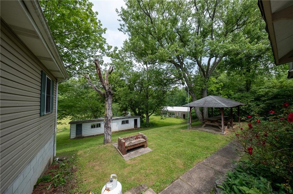1539 Dime Road Vandergrift, PA 15690 - Photo 18 of 27 a view of a backyard with furniture and a garden
