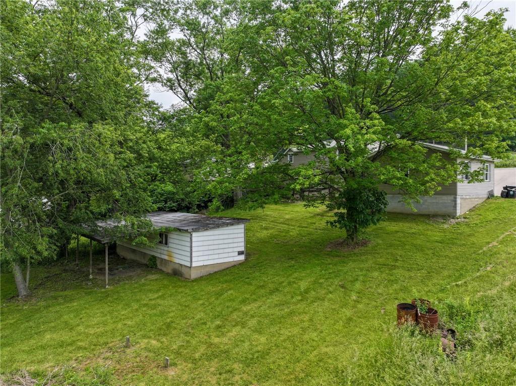 1539 Dime Road Vandergrift, PA 15690 - Photo 19 of 27 a backyard of a house with table and chairs