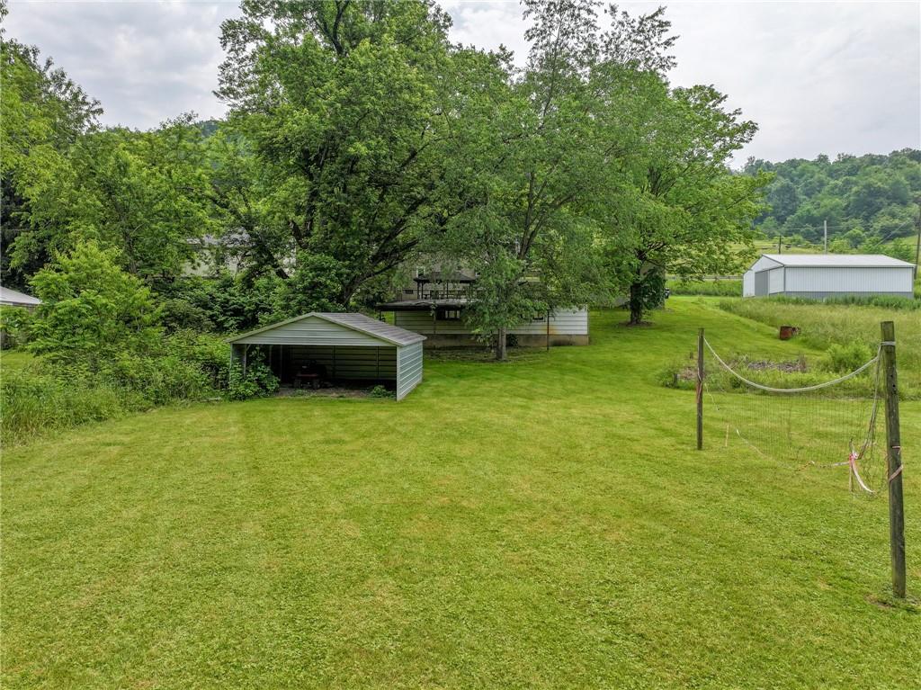 1539 Dime Road Vandergrift, PA 15690 - Photo 20 of 27 a backyard of a house with table and chairs