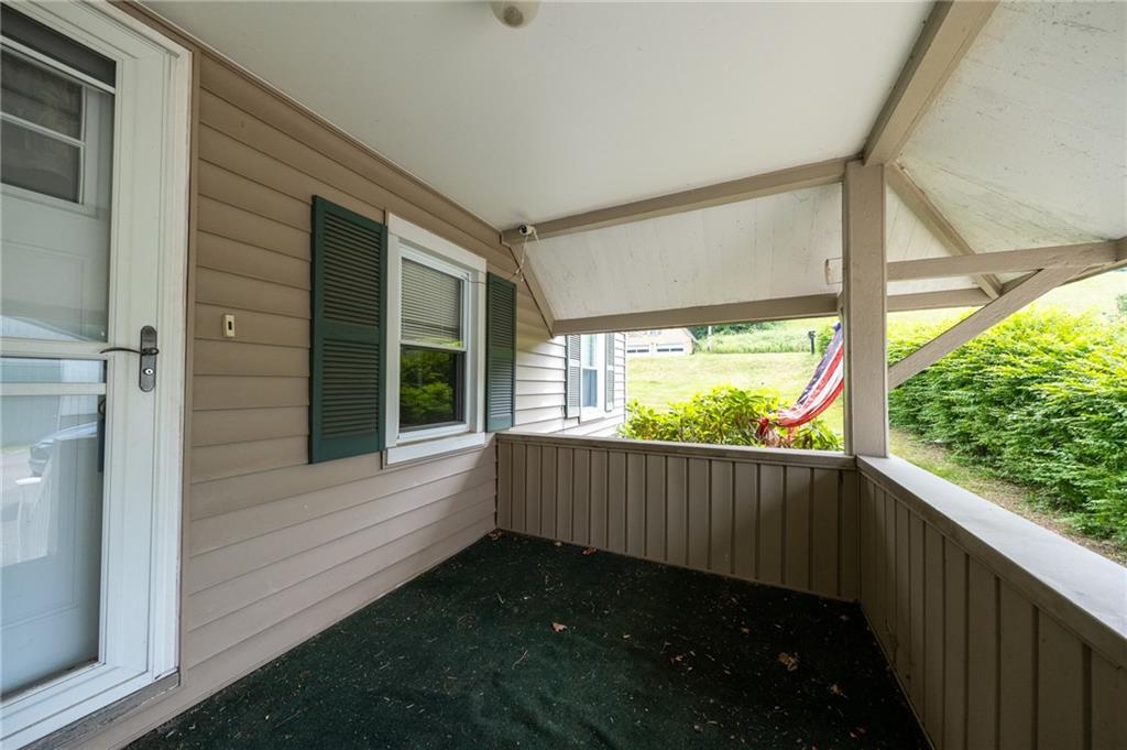 1539 Dime Road Vandergrift, PA 15690 - Photo 2 of 27 a view of a porch with wooden floor and a yard