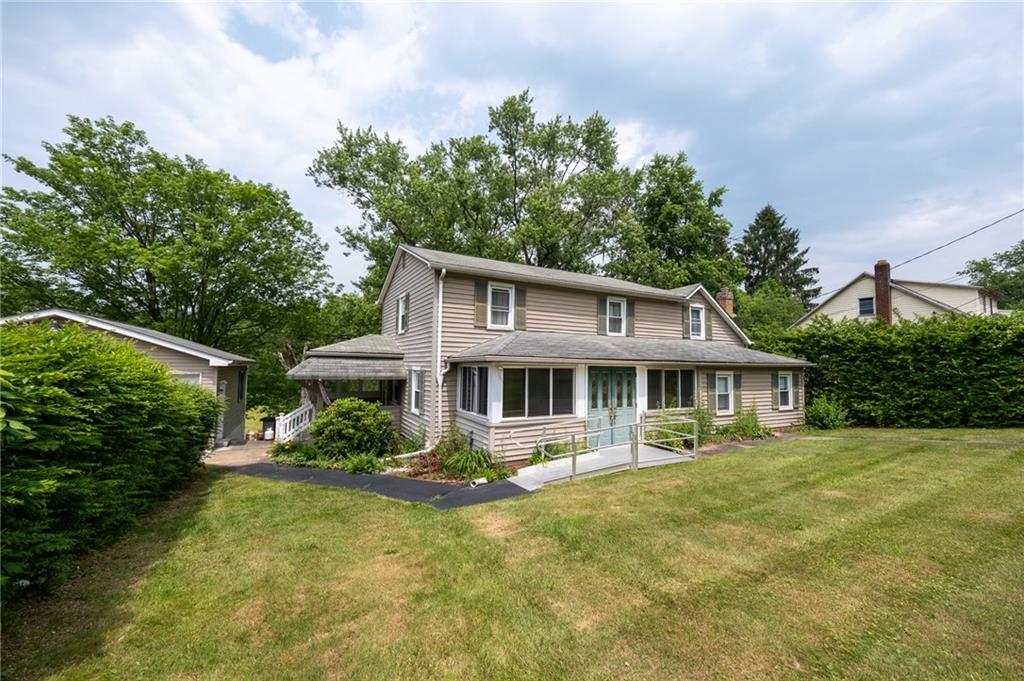 1539 Dime Road Vandergrift, PA 15690 - Photo 27 of 27 a front view of a house with a yard table and chairs