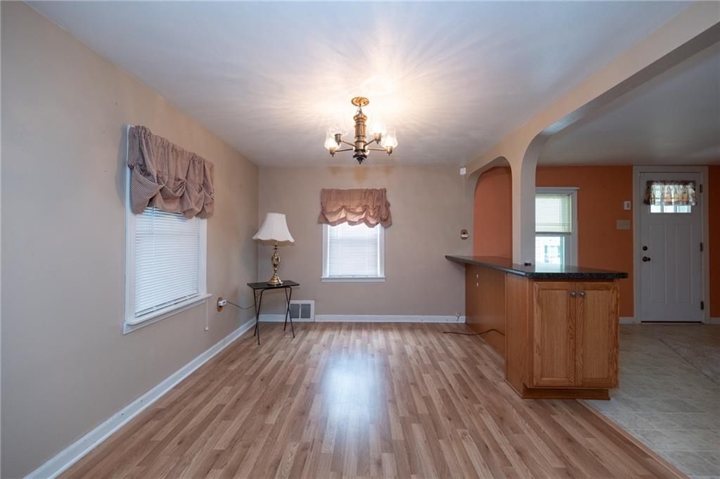 1539 Dime Road Vandergrift, PA 15690 - Photo 4 of 27 wooden floor in an empty room with a window