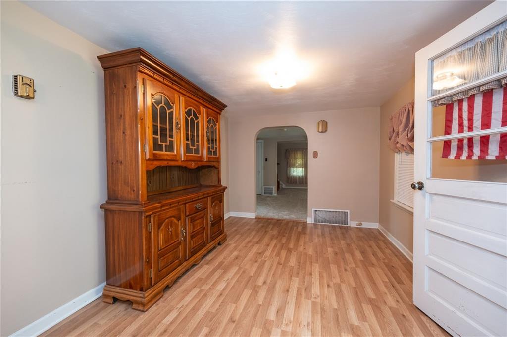 1539 Dime Road Vandergrift, PA 15690 - Photo 5 of 27 wooden floor in an empty room and a window