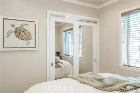 a bedroom with a bed and the view of bathroom