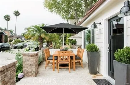 a view of a patio with furniture and a potted plants